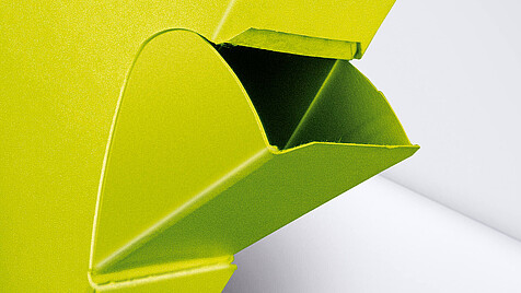 Yellow folding box with pour opening as close-up