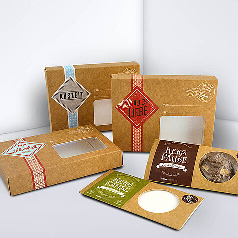 Various folding boxes for biscuits with a viewing window