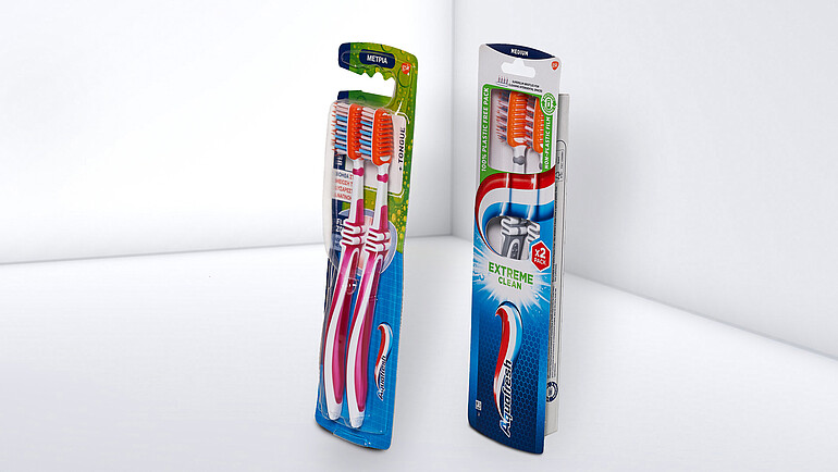 Plastic-free toothbrush packaging with innovative patched window