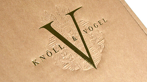 Printed logo with golden lettering and embossing