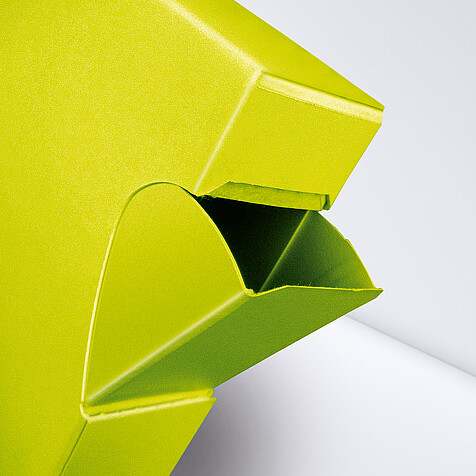 Yellow folding box with pouring opening as a close-up