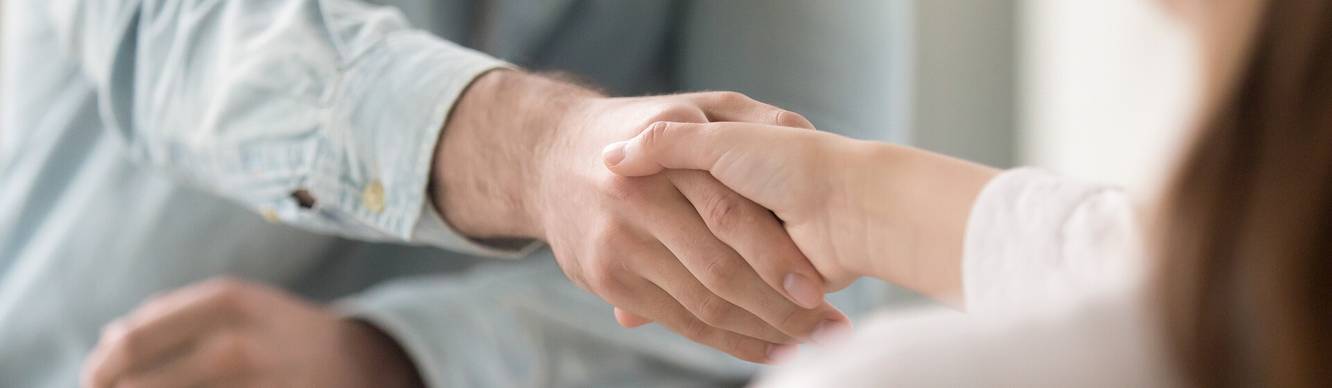 Man and woman shaking hands